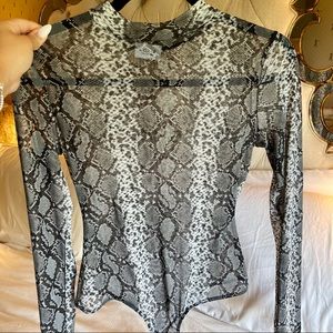Snake print bodysuit from Le Lis Collection✨🖤